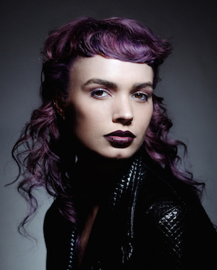 model with purple hair and leather jacket